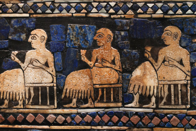 Men drinking from conical cups on the banquet side of the royal standard of Ur
