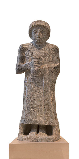 Diorite Statue of Gudea holding vase of flowing water