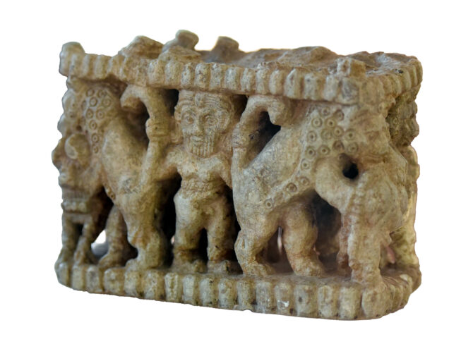 sculptured box showing master of beasts motif from tell Agrab