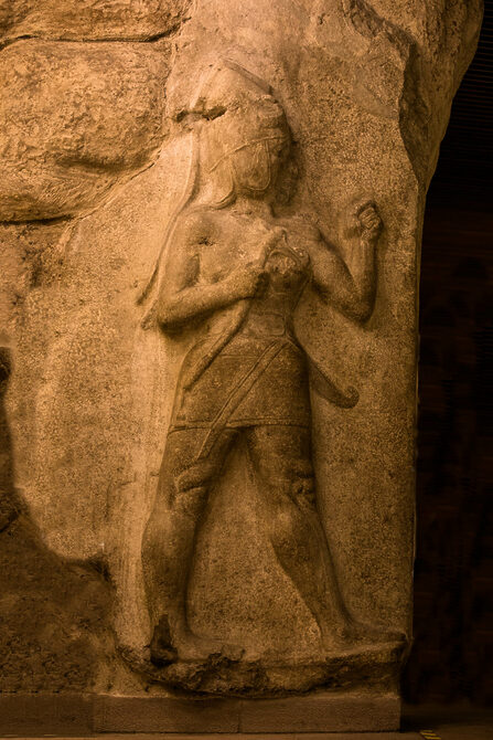 Hittite King or Deity carrying battle axe flanking gate of city of Hattusa