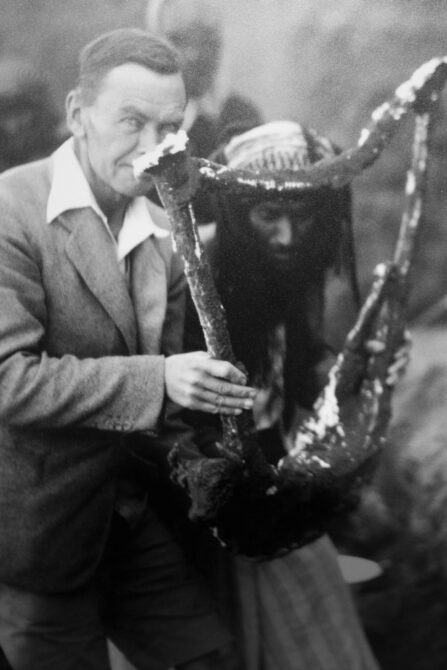 Picture of Woolley carrying a harp found in the Great Death Pit of Ur