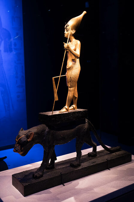 Pharaoh Tutankhamen standing on back of panther
