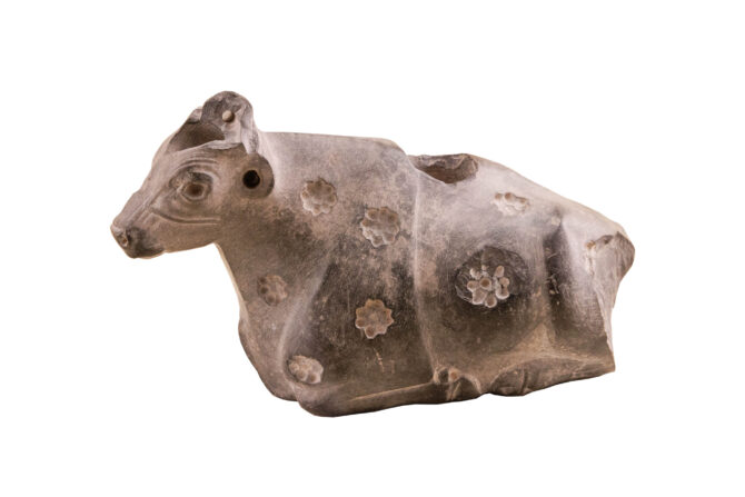 Couchant Cow with rosettes from Mesopotamia